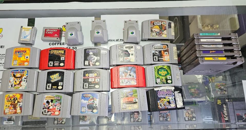 A bunch of Nintendo Entertainment System games and Nintendo 64 games being traded into 6R's entertainment yard.