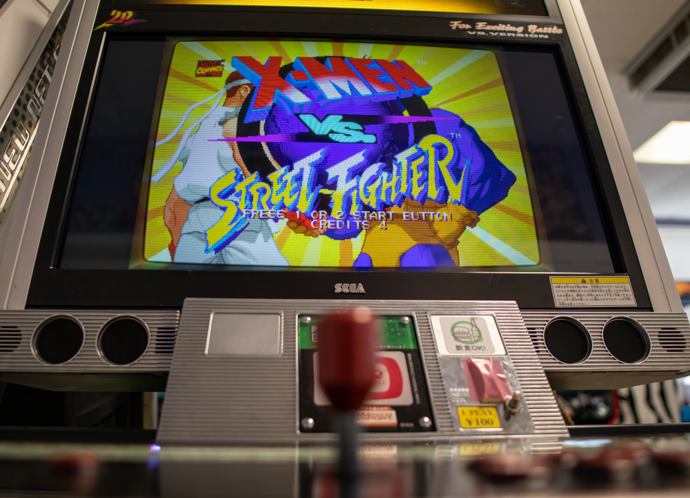 Low-angled shot of arcade stick and Lindy arcade cabinet at 6R's entertainment yard