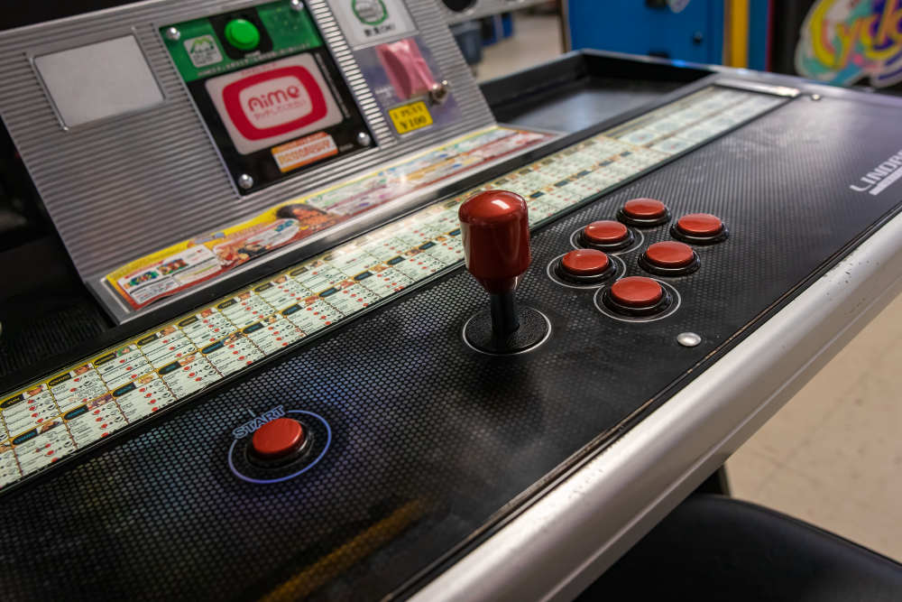 High-angled shot of arcade stick and Lindy arcade cabinet at 6R's entertainment yard