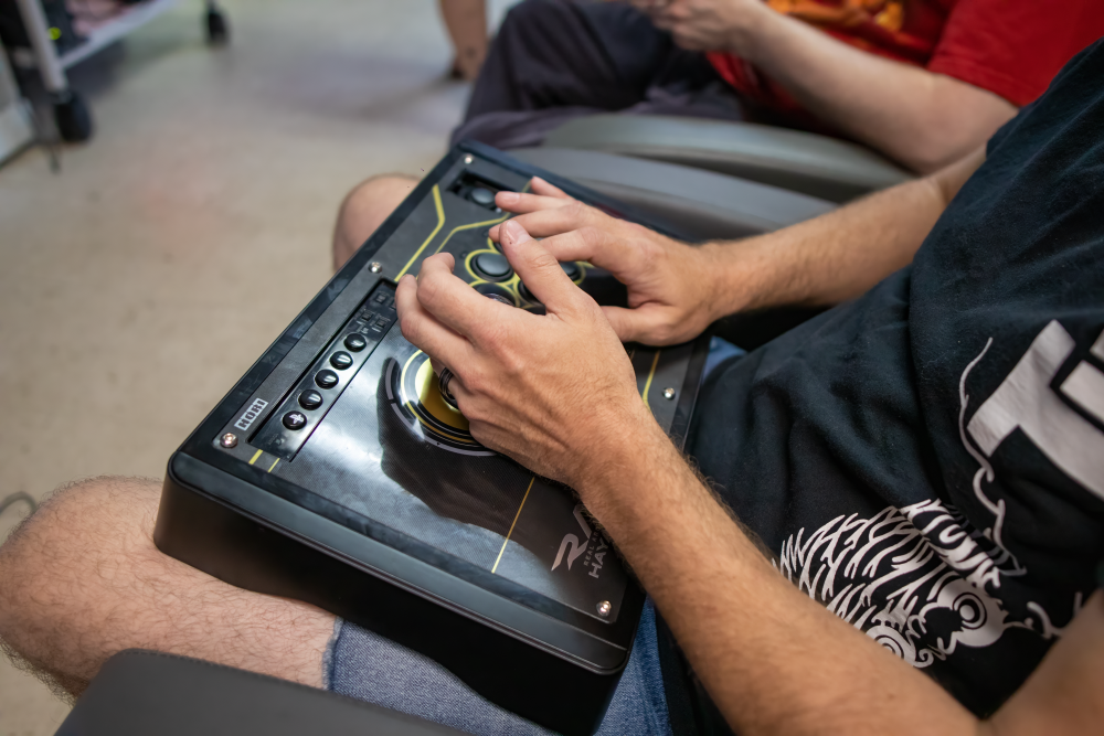 Picture of someone using arcade stick at 6R's entertainment yard