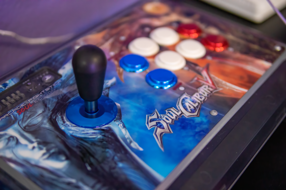 Picture of red and blue custom arcade stick at 6R's entertainment yard