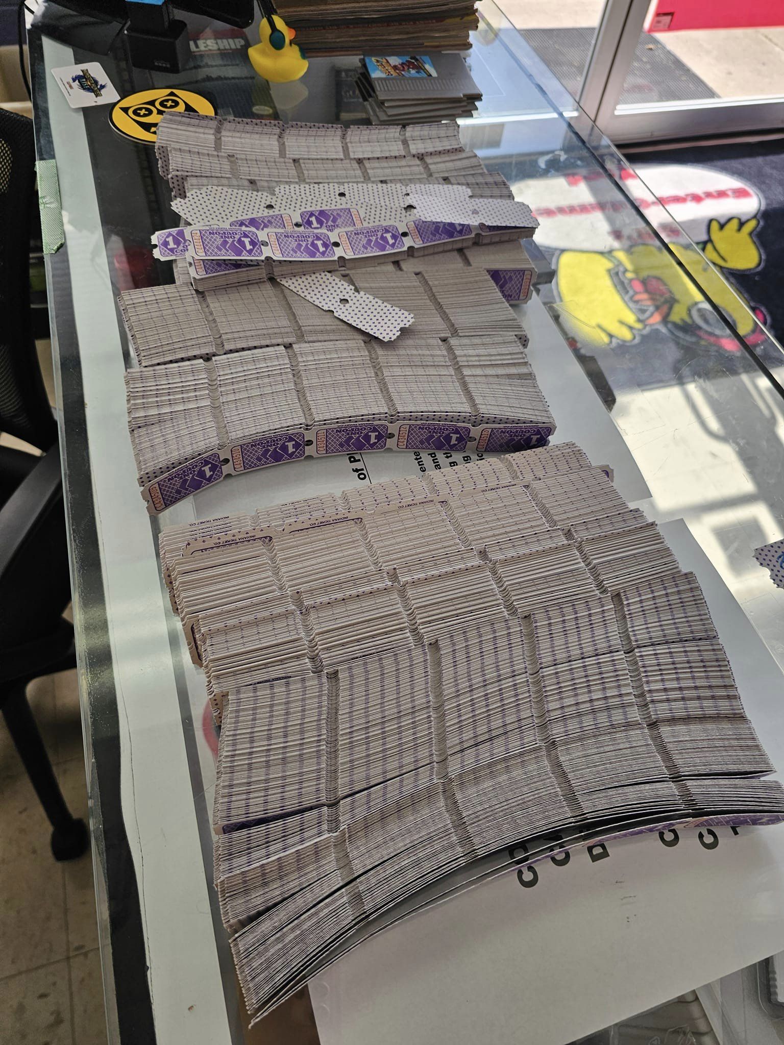 A bunch of tickets on the counter at 6R's entertainment yard