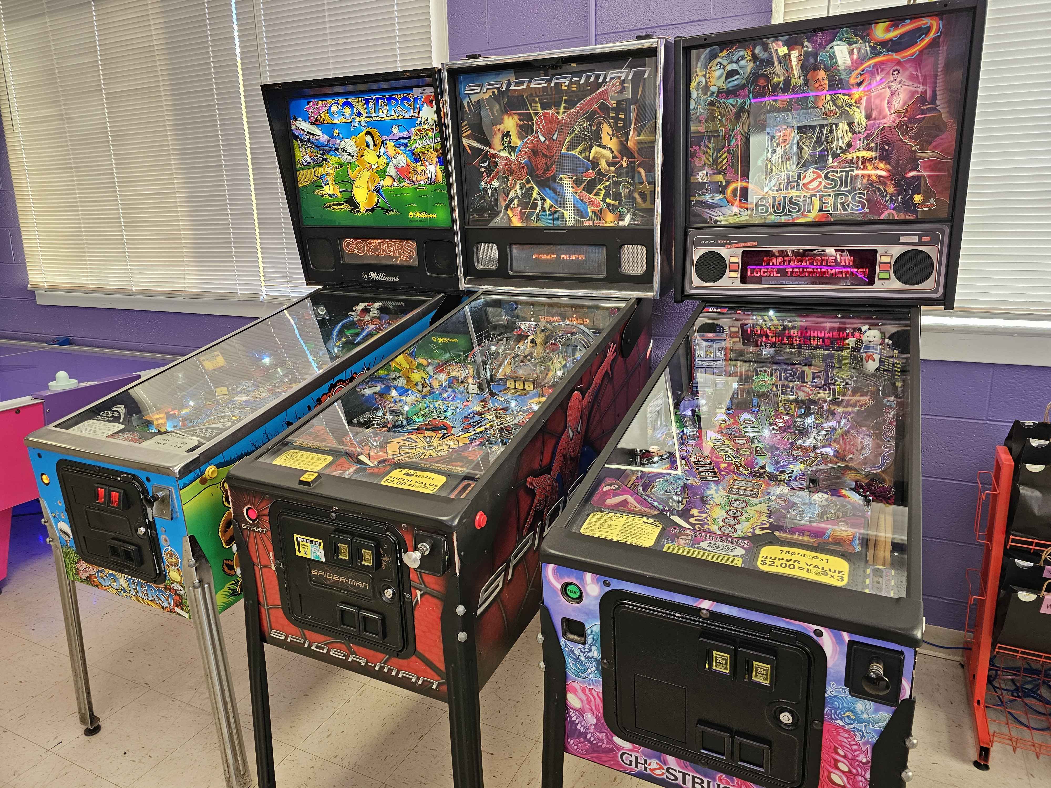 Three pinball machines. Gophers, Spiderman, and Ghostbusters